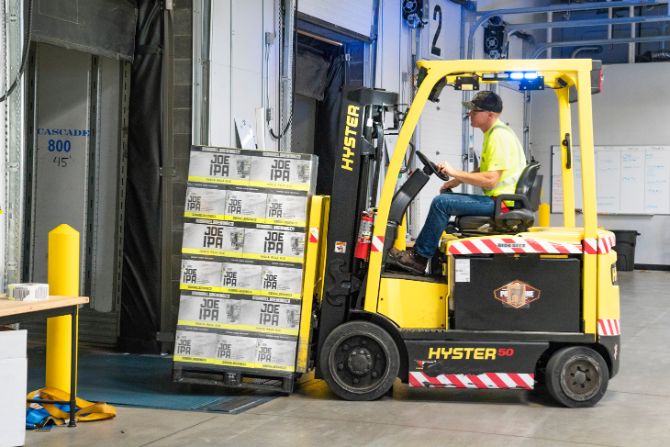 Priority Domestic Air Freight in Mexico warehouse loading high-value cargo for urgent delivery