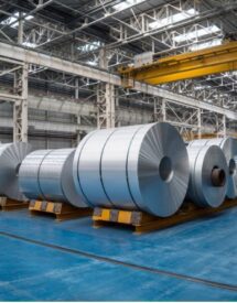 Mexico-US trade tariffs 2025 impacting steel exports – rolls of steel in a manufacturing facility.