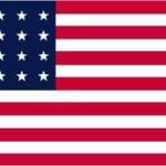 The flag of the United States, featuring 13 horizontal stripes in red and white, and a blue rectangle with 50 white stars in a grid pattern.